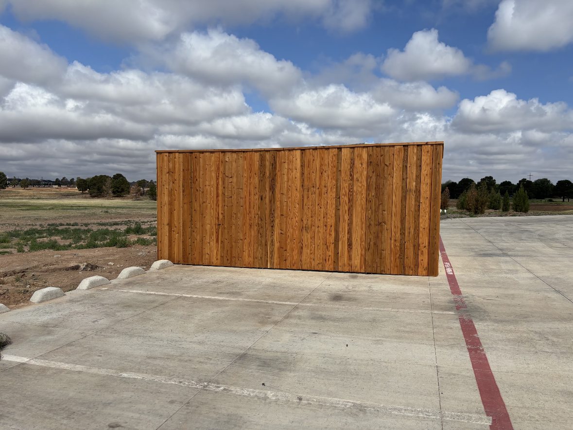 Battery enclosure finished with wood screening